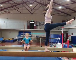 Amelia showing good form for junior gymnasts.